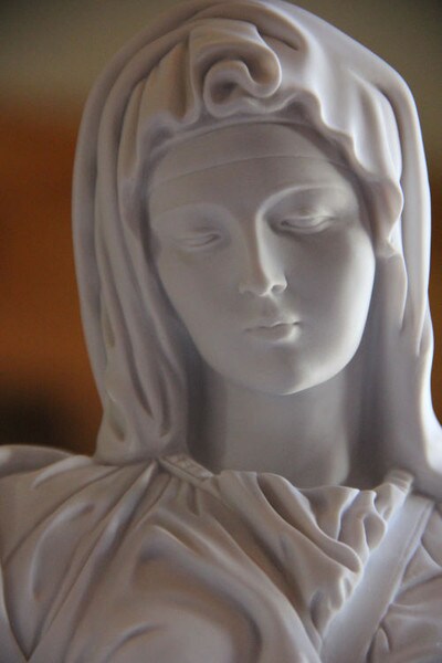 Pieta marble statue Blessed Mother Mary Close up Face sculpture Michelangelo